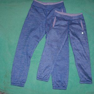 2 pairs of purple joggers one is 7-8 and 4-5